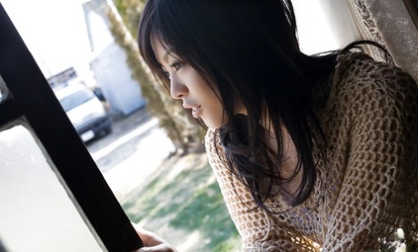 Sweet asian teenage babe China Yuki revealing her tempting body