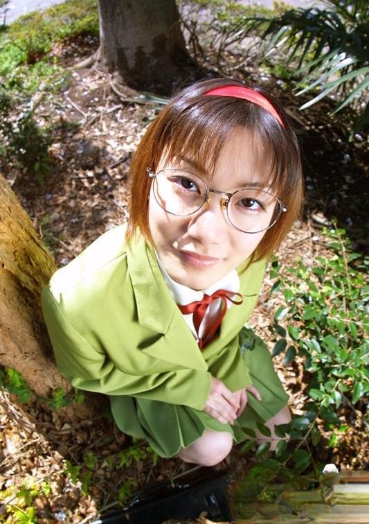 Naughty asian babe in glasses and school uniform revealing her titties