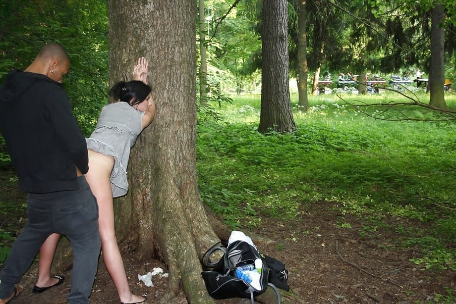 Slutty brunette gets picked up and fucked outdoors by two well-hung guys