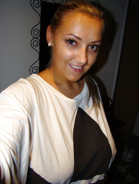 Chubby teenage blonde with massive melons stripping and picturing herself