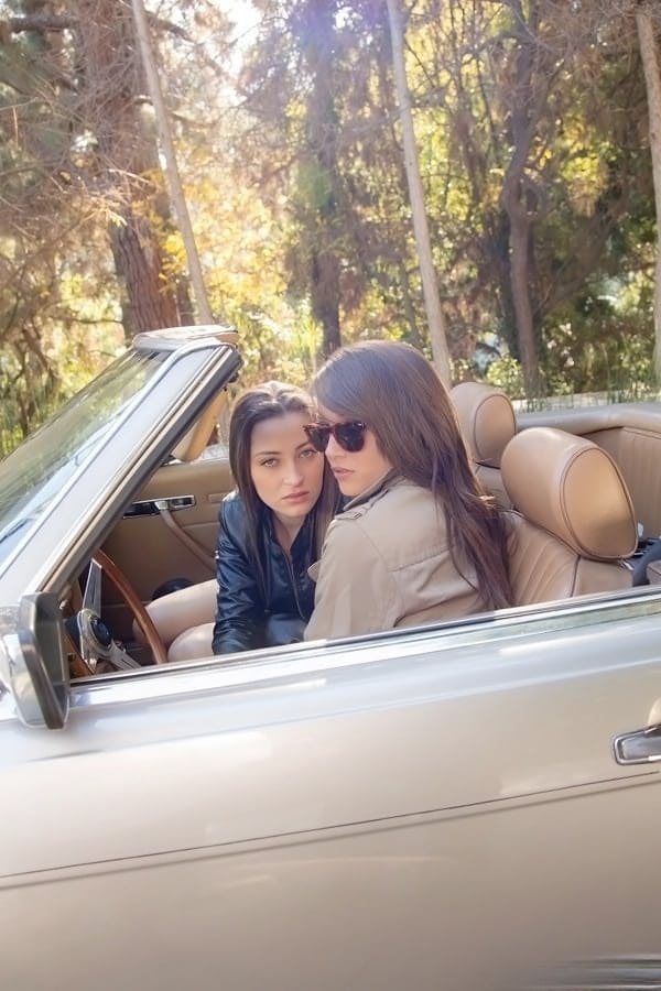 Sexy chick Dani Daniels making out with her lesbian friend outdoors