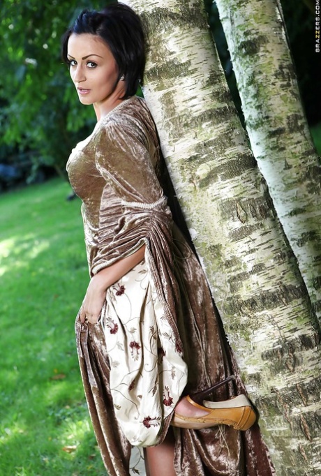Hot babe Keira Knight taking off her snazzy dress and posing nude outdoors