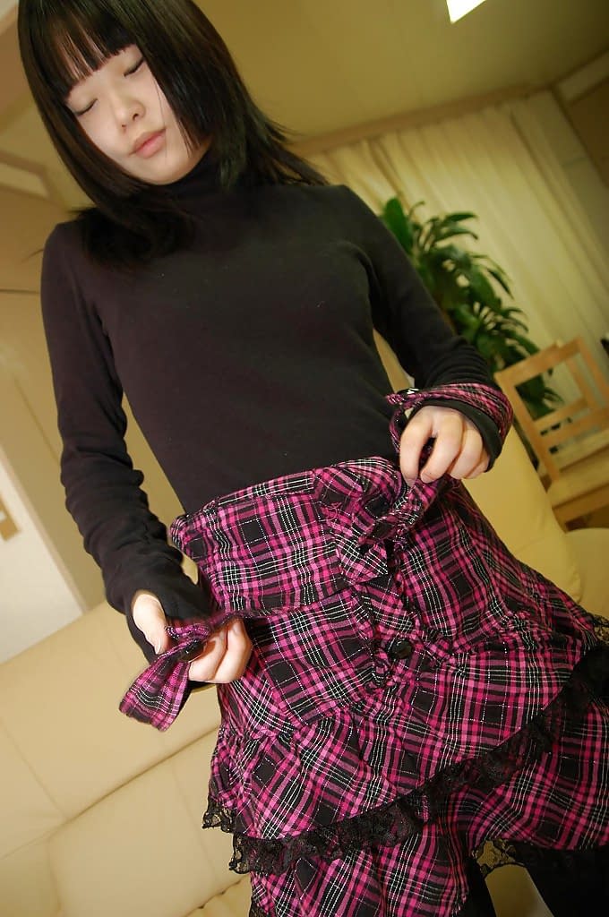 Playful asian schoolgirl Rio Takei getting rid of her clothes
