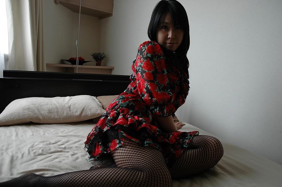 Asian MILF in pantyhose stripping and spreading her hairy pussy lips