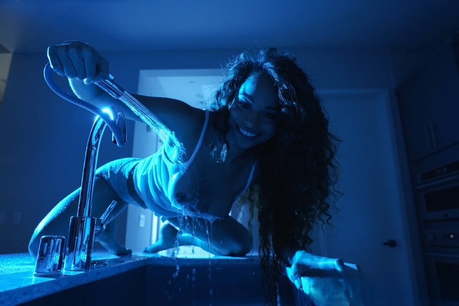 Curly haired ebony angel Cecilia Lion gets her shirt and adorable ass wet