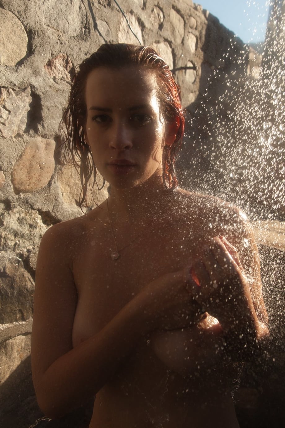 Busty babe Orli Krowan loses her sheer purple dress outdoors & takes a shower
