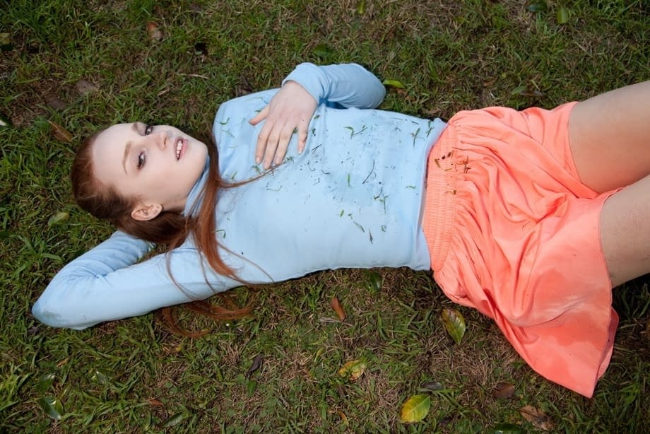 Stunning redhead teen Sarah Rupe flashing an upskirt in white panties outdoors