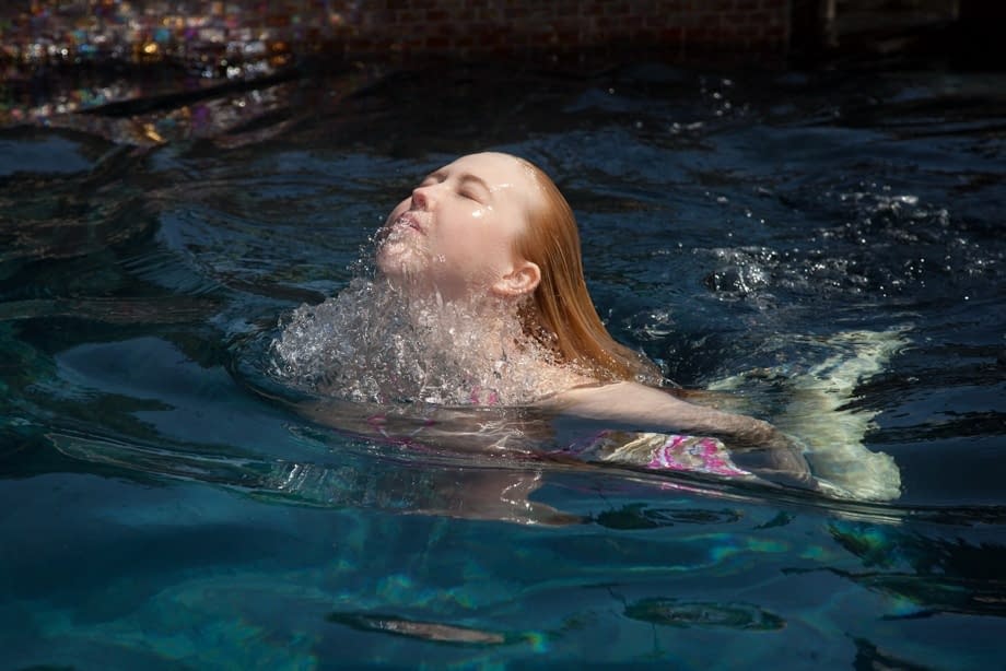 Half-naked babe Samantha Rone stretching and showing her boobs in the pool