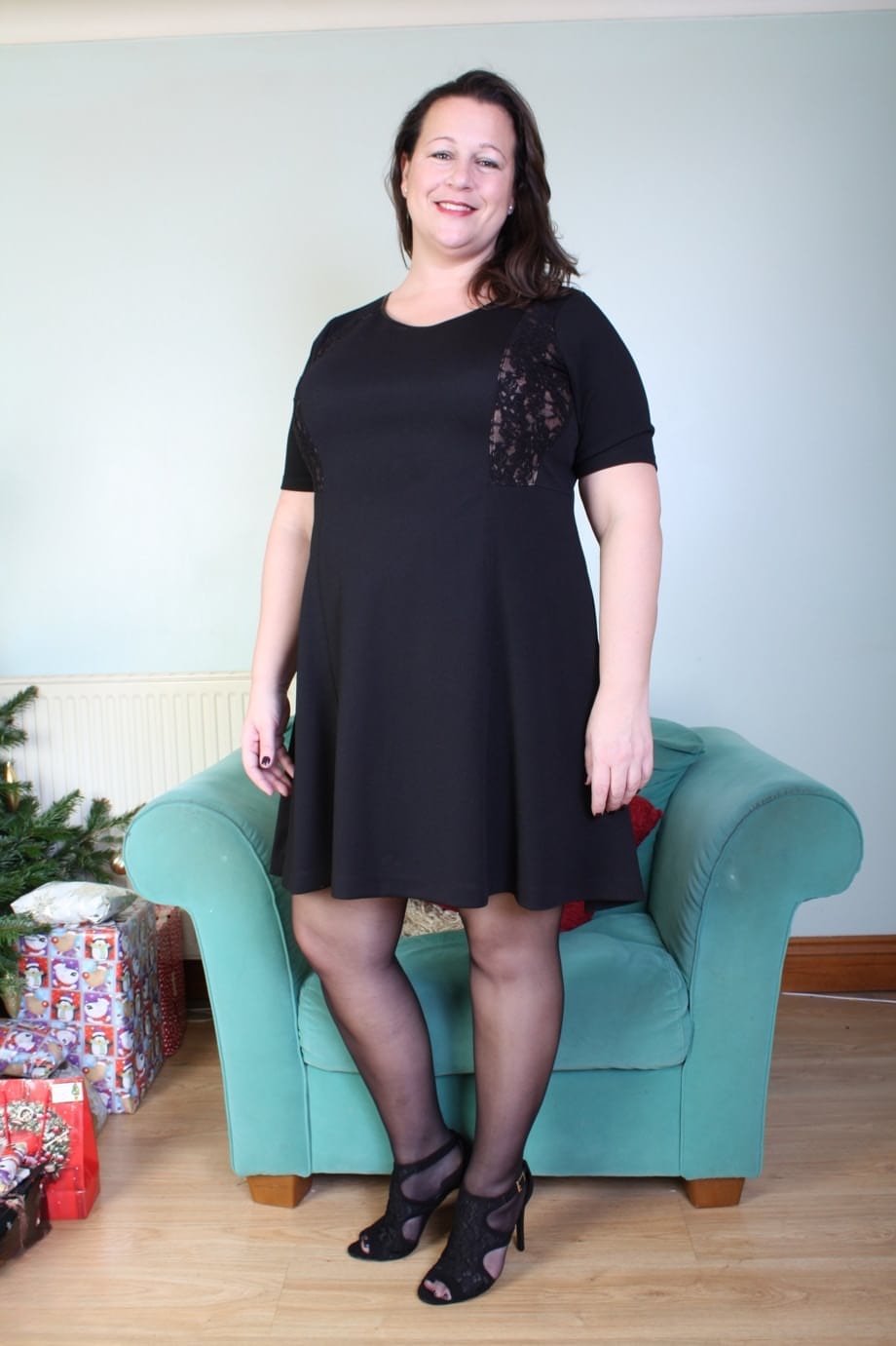 Brunette mom Eva Jayne removes her black dress and flaunts her curves