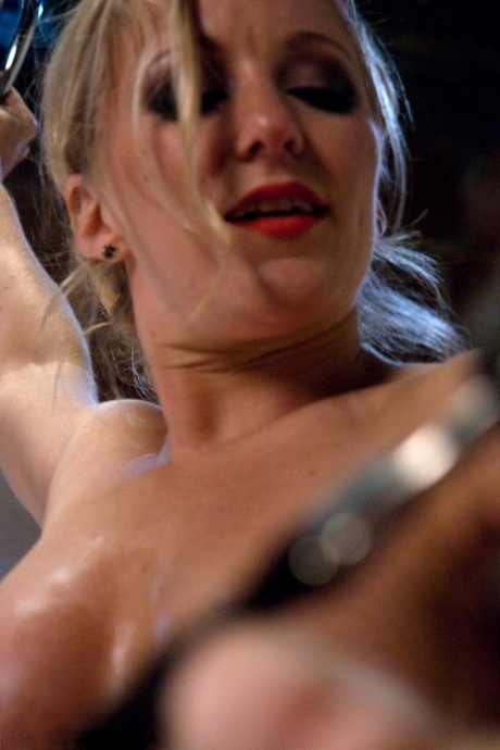 Busty blonde Dia Zerva pegs a restrained man before stimulating his penis