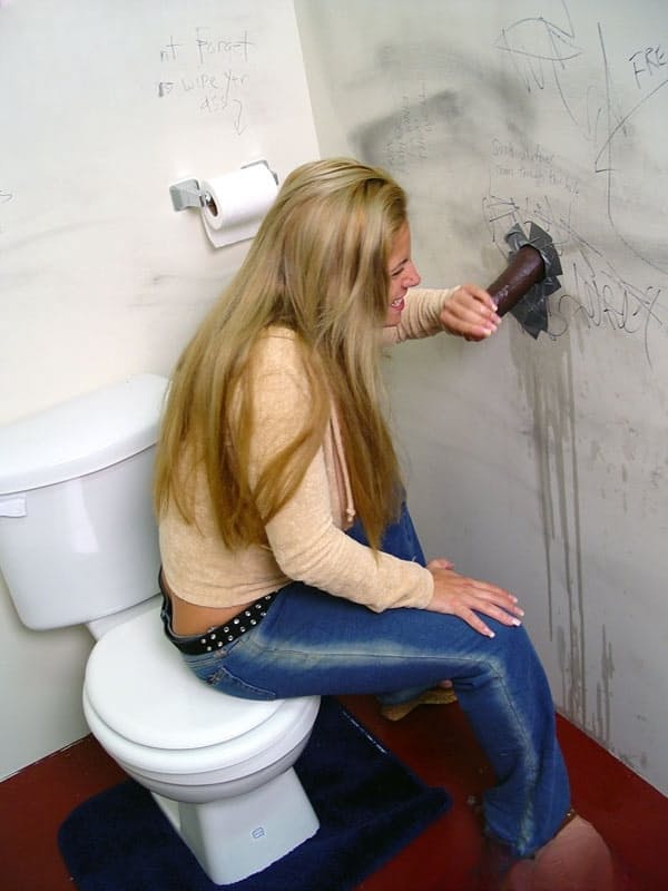 Insatiable cougar Friday throating big dark meat pole at a gloryhole