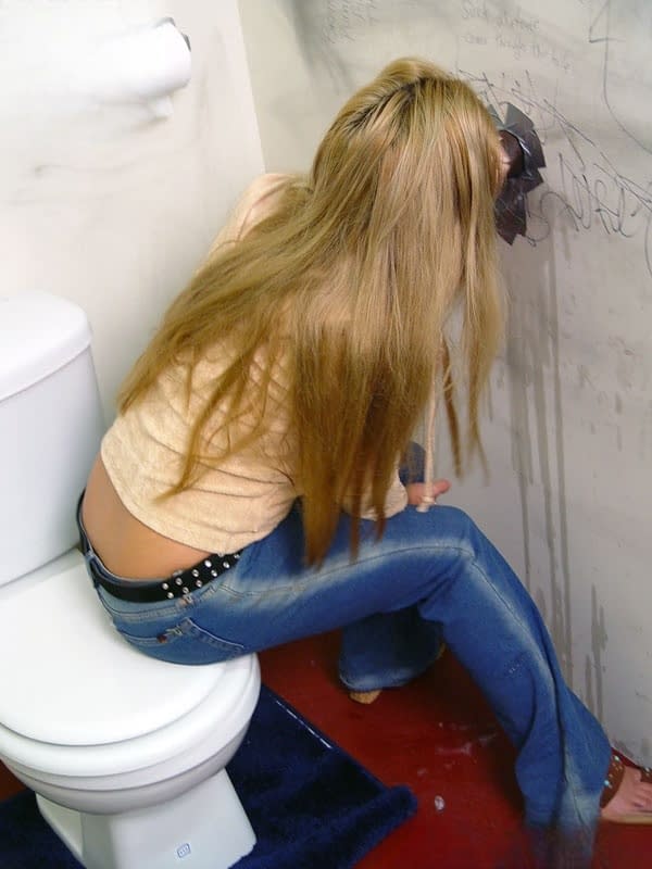 Insatiable cougar Friday throating big dark meat pole at a gloryhole