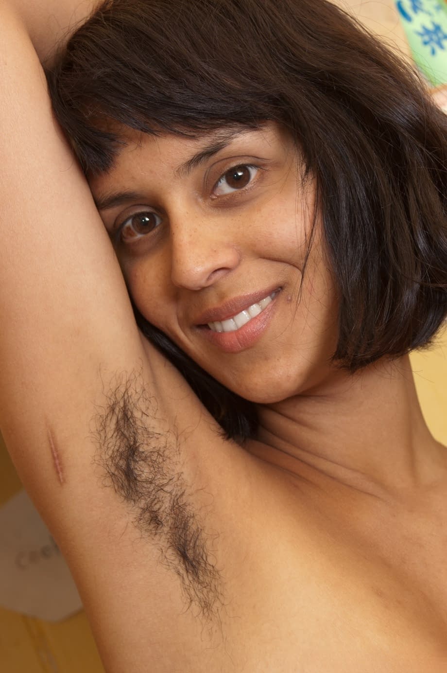 Exotic amateur Sonya N showcases her hairy armpits & masturbates