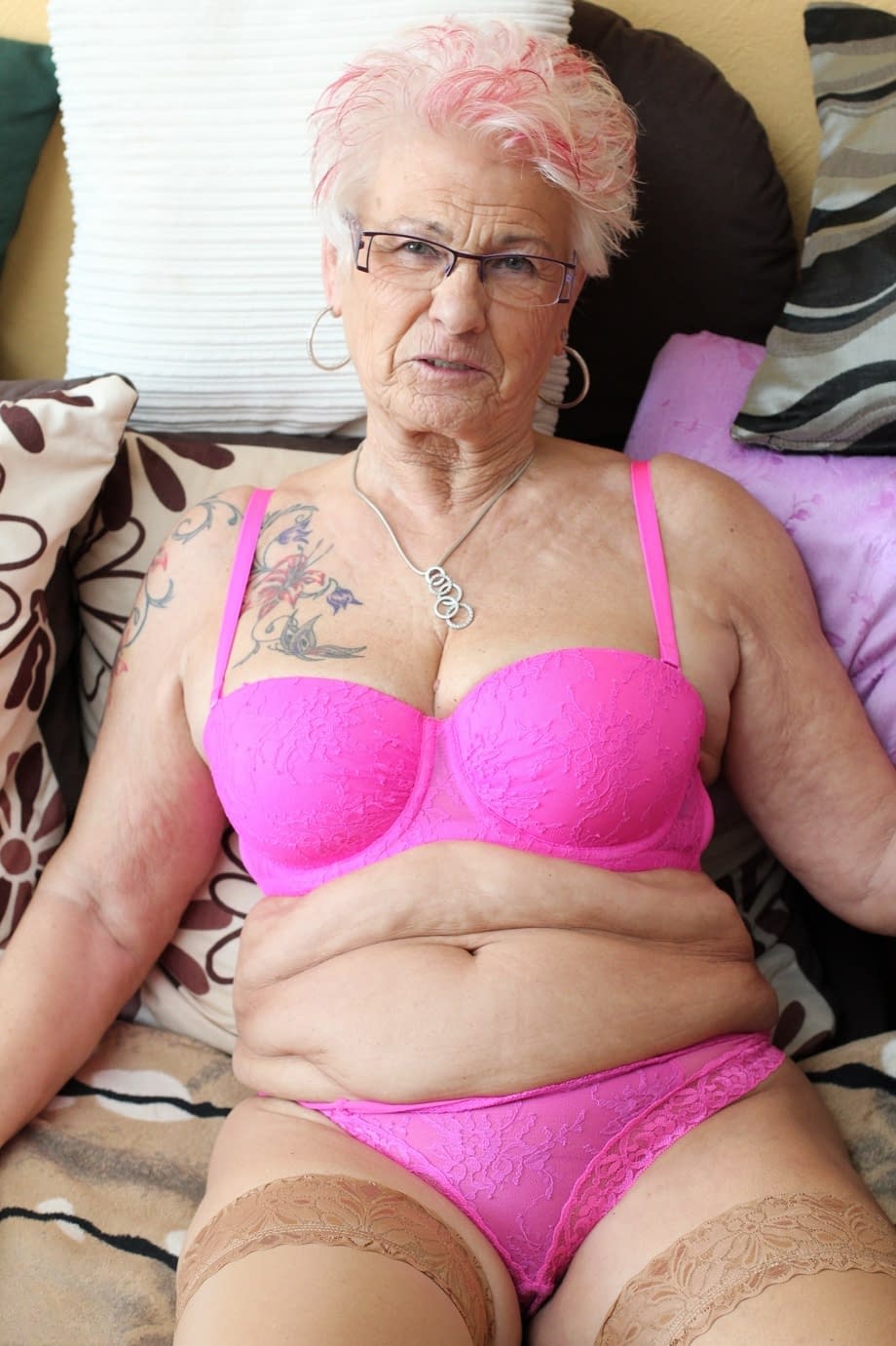 German granny Gerdi strips & spreads her sweet shaved old pussy on a bed