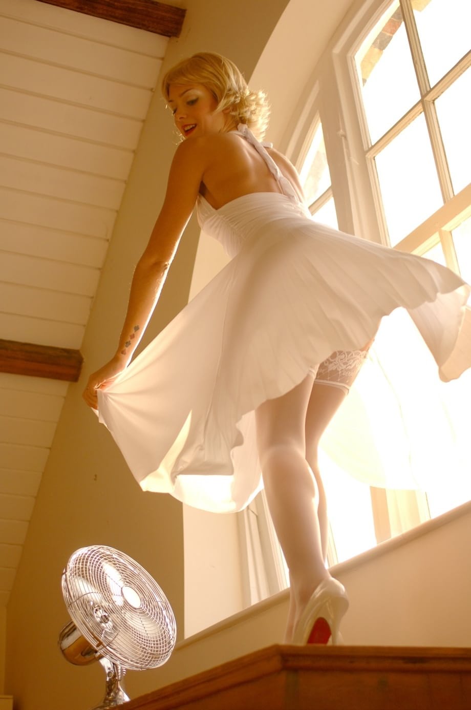 British MILF in a white dress Natasha Marley flashes her panties and stockings