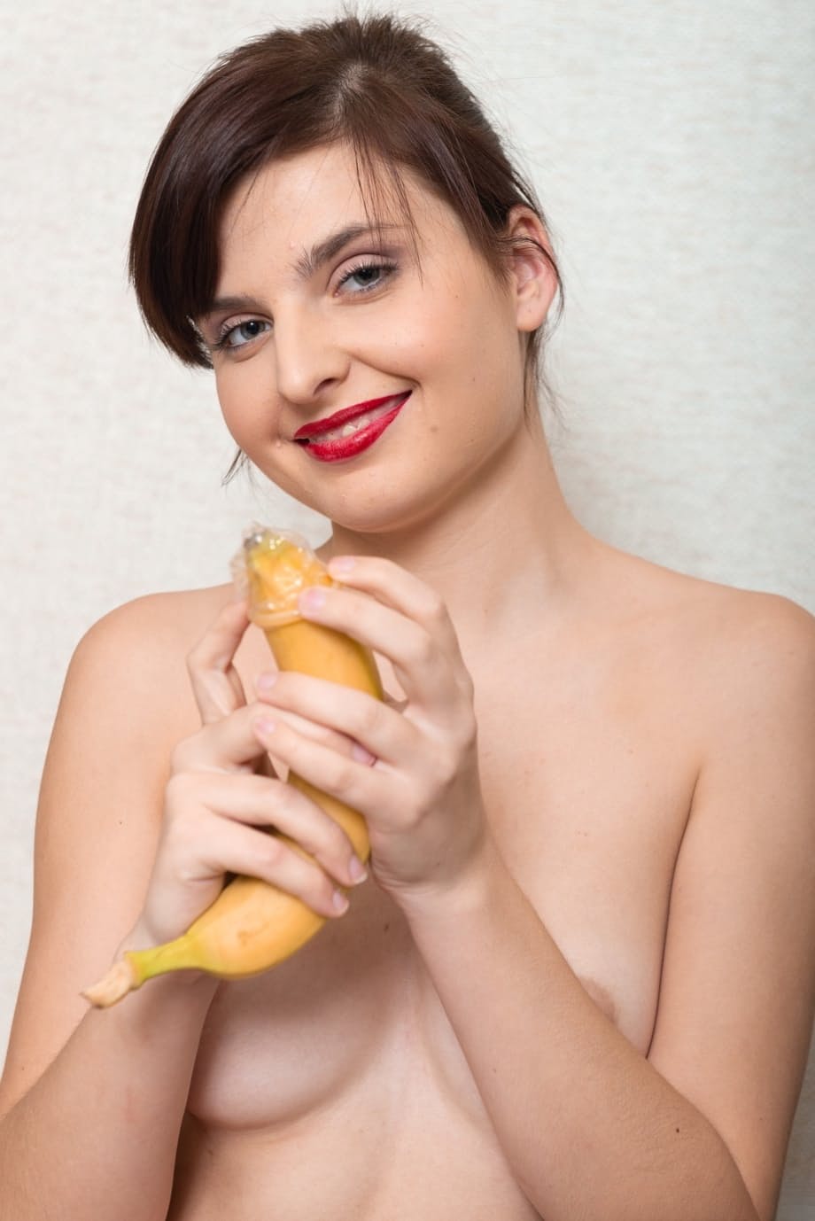 Russian secretary Zlata inserting a banana in her furry vagina at the office