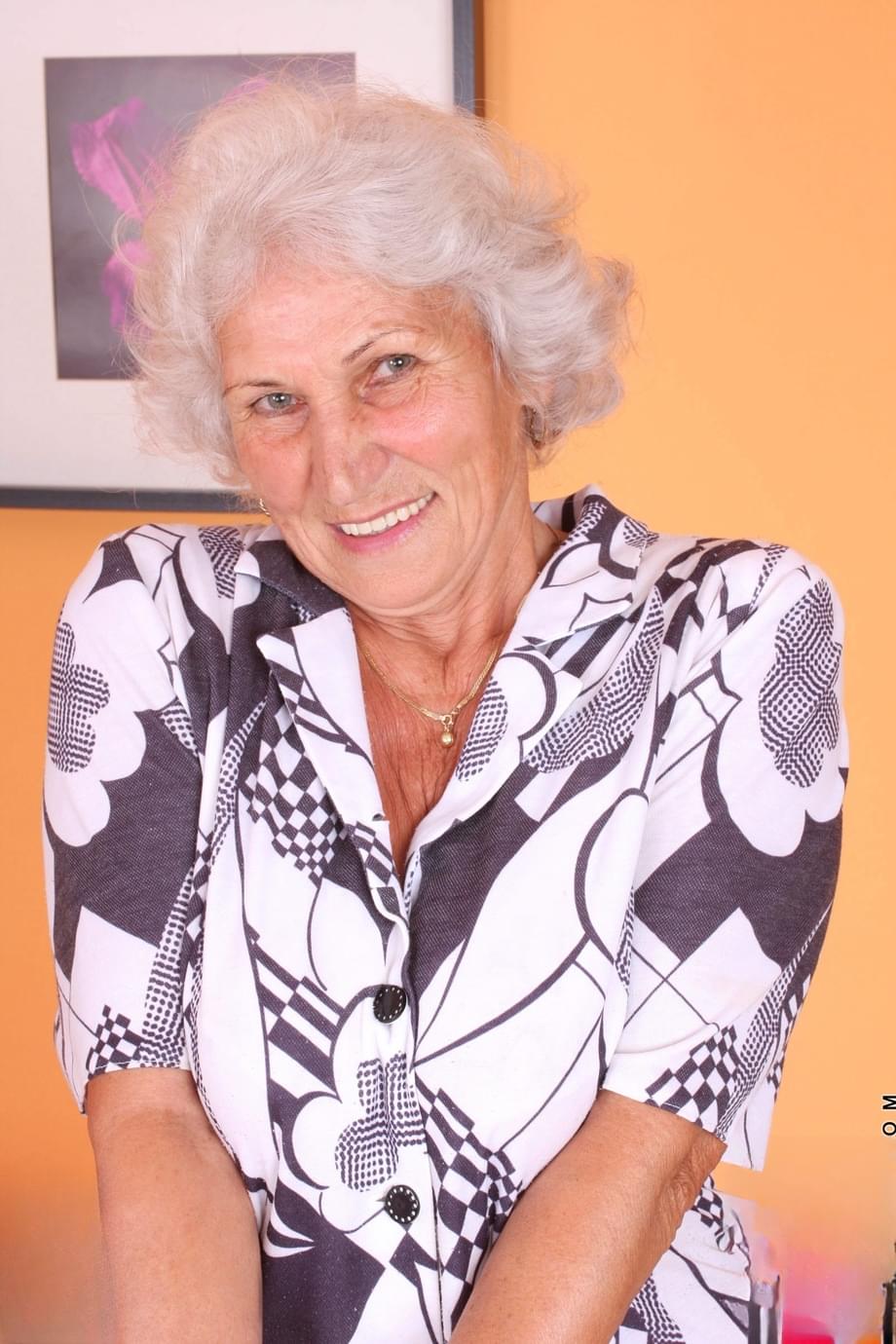 Grey haired granny Betty exposes her saggy juggs and fingers her clam
