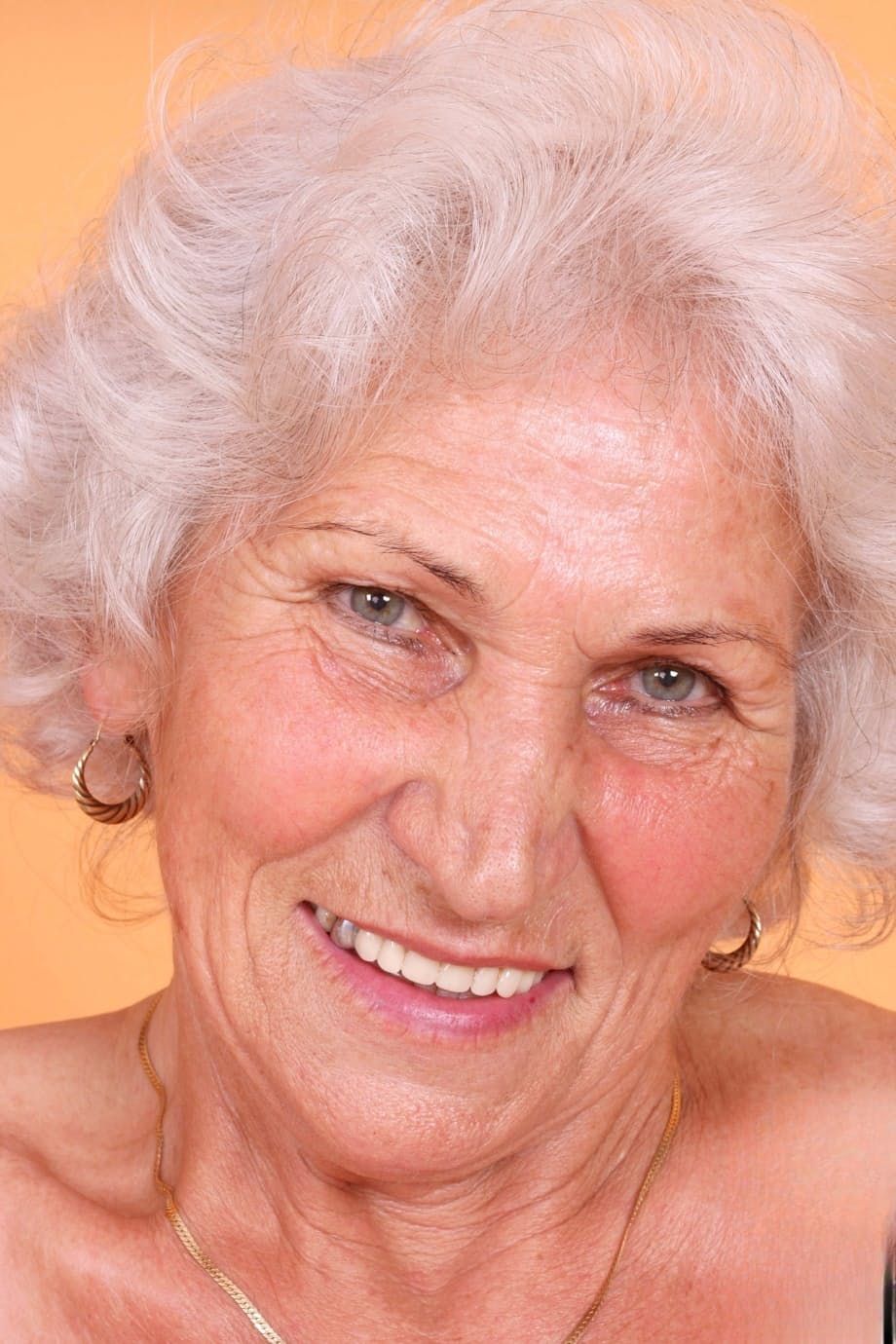 Grey haired granny Betty exposes her saggy juggs and fingers her clam