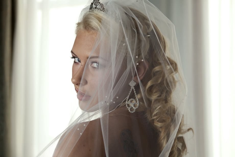 Blonde bride Katie Summers doffs her wedding dress & poses topless in lingerie