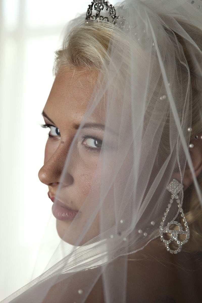 Blonde bride Katie Summers doffs her wedding dress & poses topless in lingerie