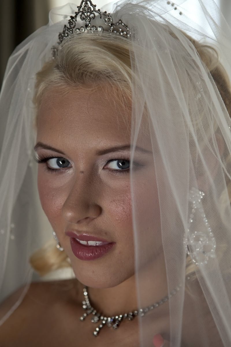 Blonde bride Katie Summers doffs her wedding dress & poses topless in lingerie
