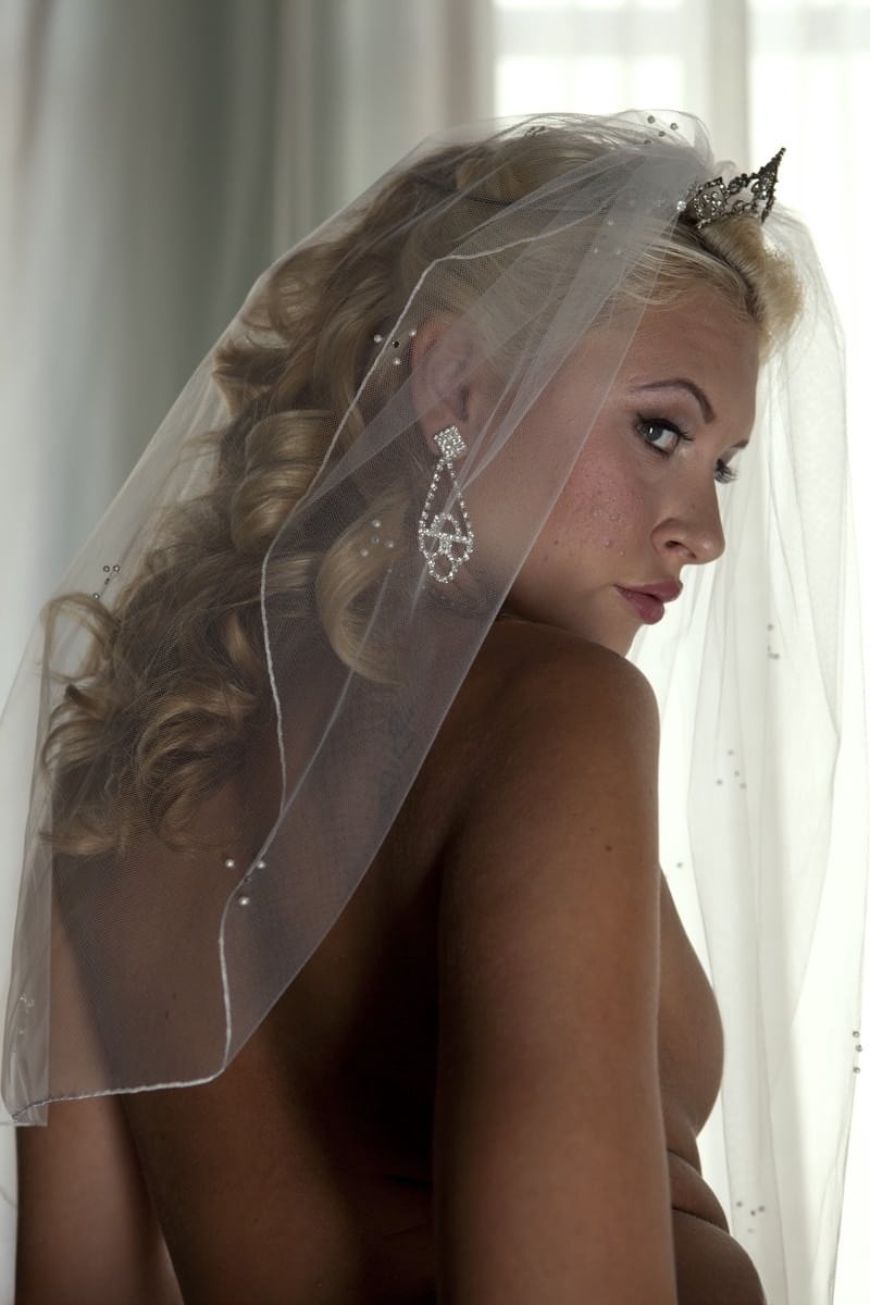 Blonde bride Katie Summers doffs her wedding dress & poses topless in lingerie