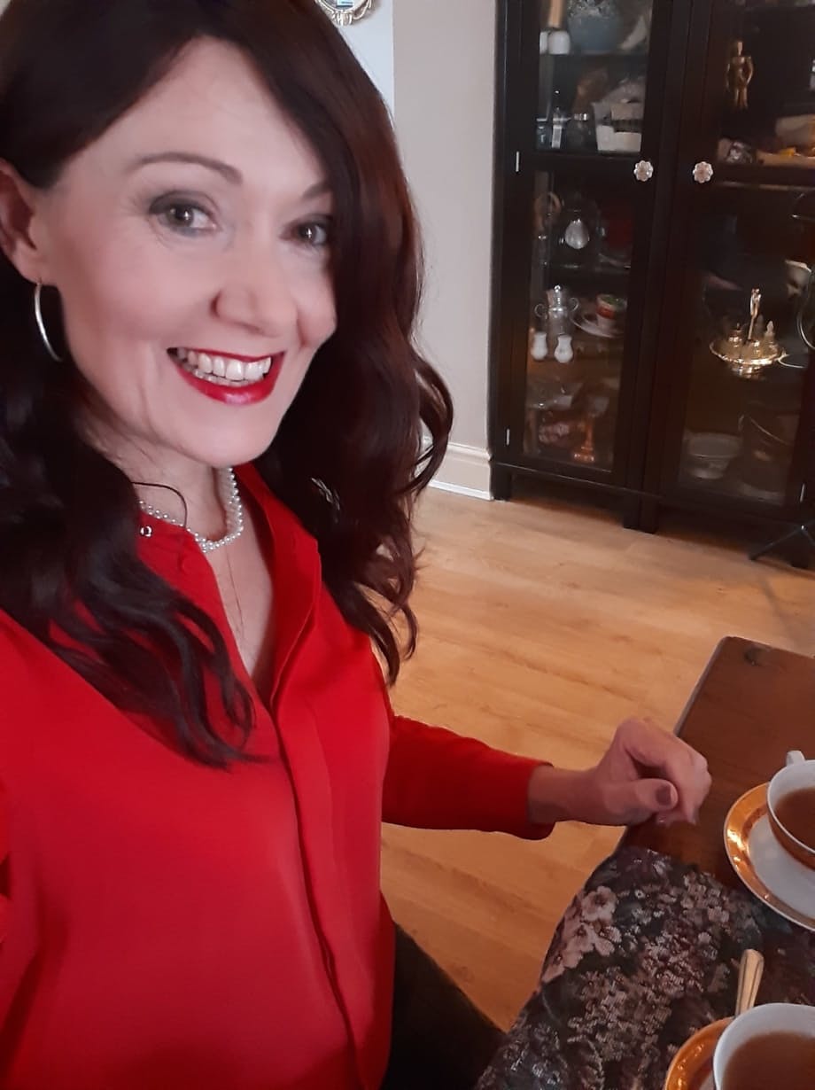Sexy MILF Kitty Cream models for a non-nude shoot while at home and alone