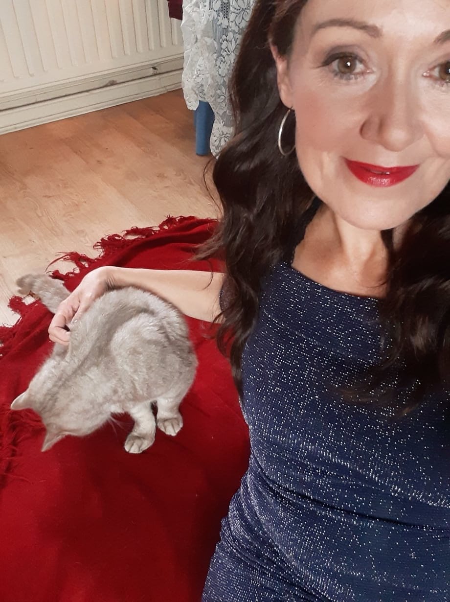 Sexy MILF Kitty Cream models for a non-nude shoot while at home and alone