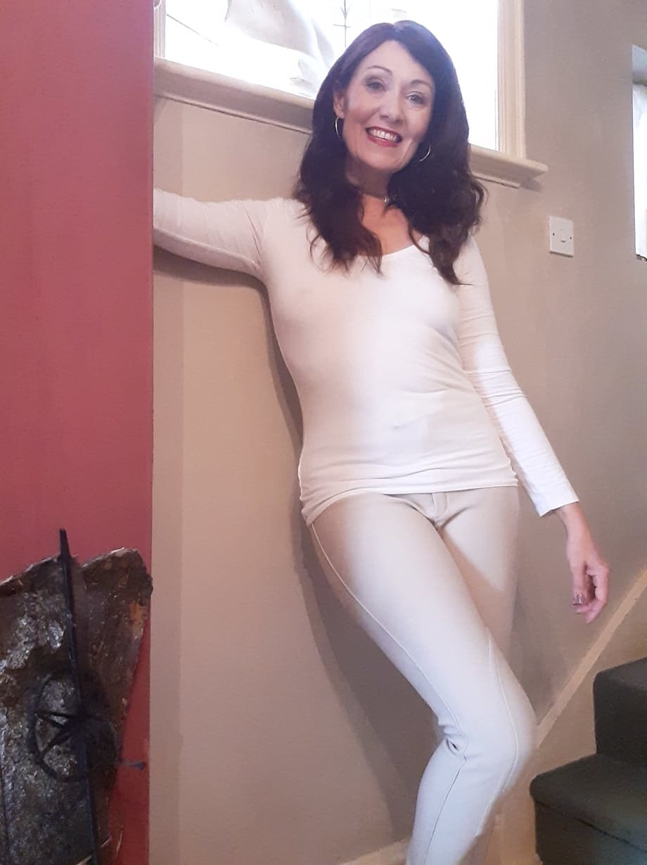 Sexy MILF Kitty Cream models for a non-nude shoot while at home and alone