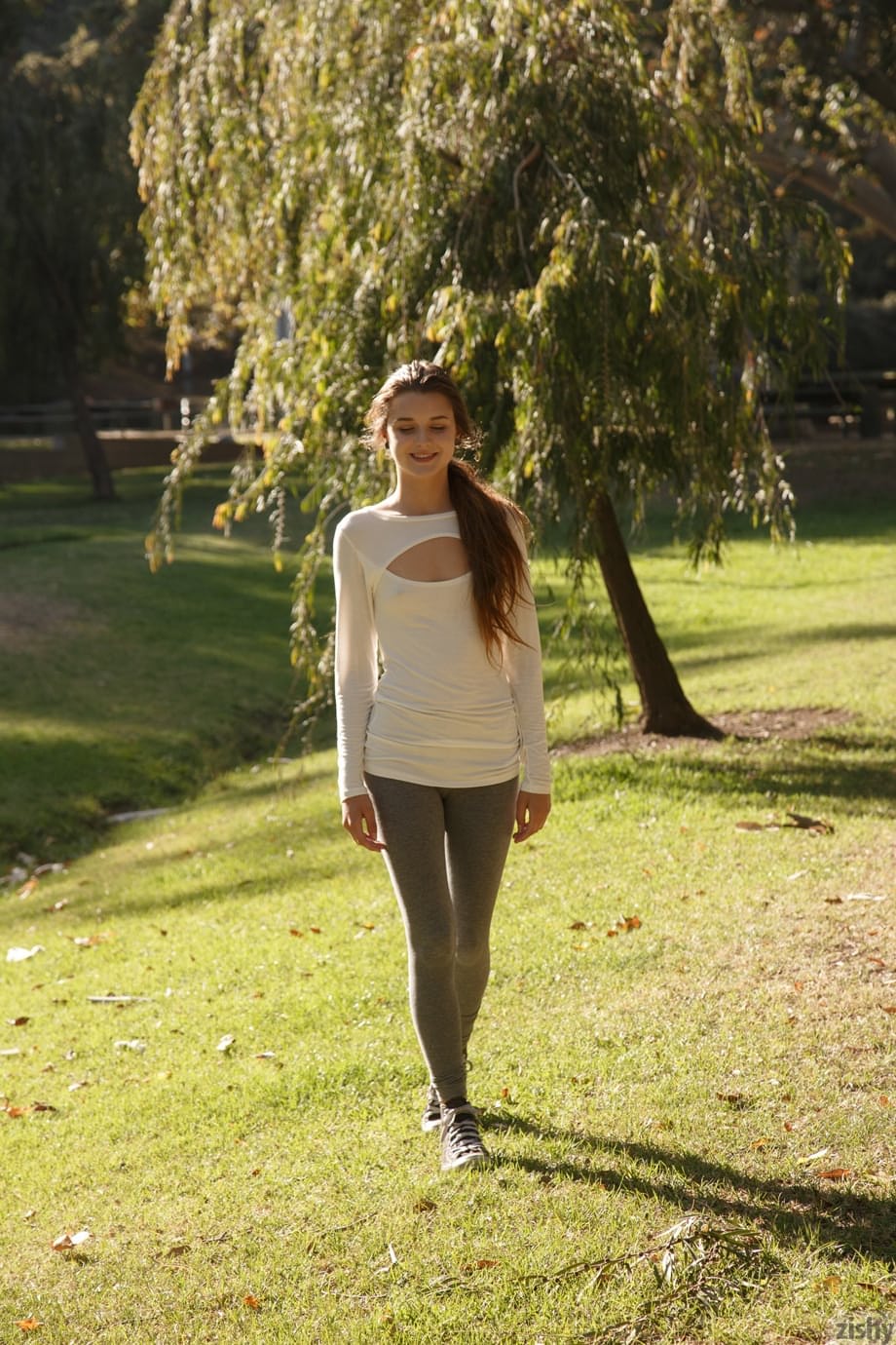Brunette teen Alex Mae exposes her nice ass in the park on canvas sneakers