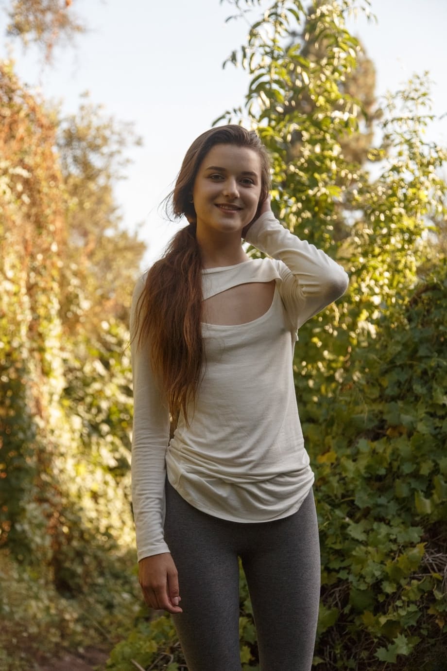Brunette teen Alex Mae exposes her nice ass in the park on canvas sneakers