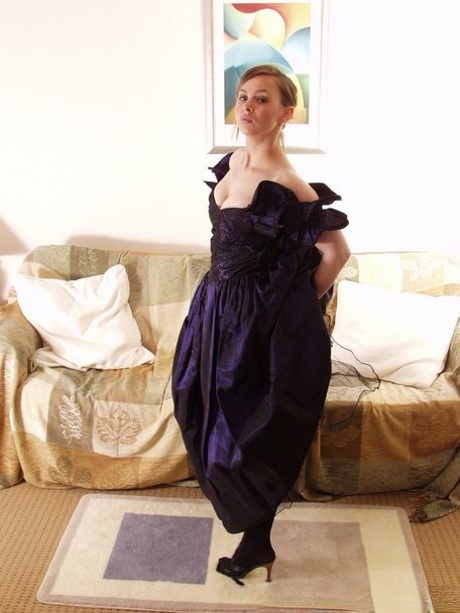 Big titted lady Claire doffs her elegant dress and teases with her perfect ass
