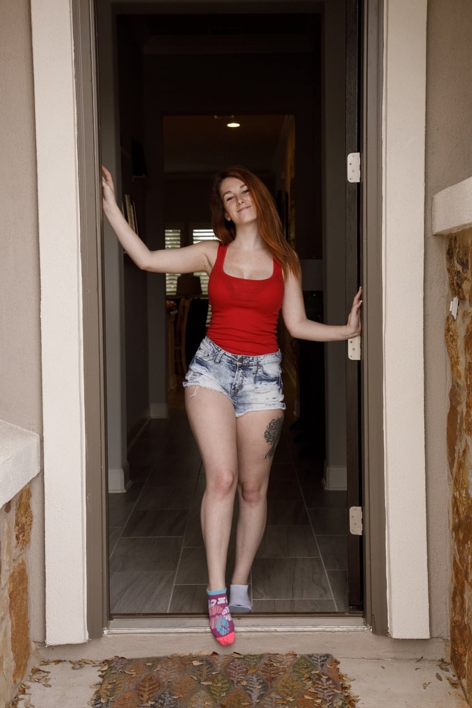 Natural redhead Ruby Corbett strips to her bra and panties at home