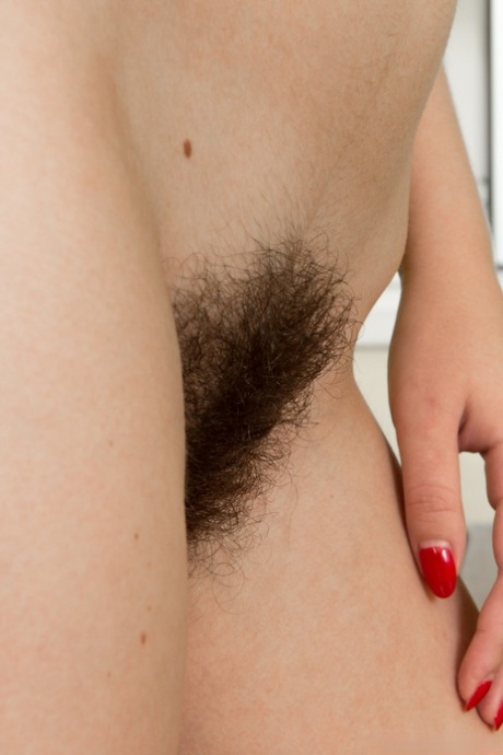 Curly-haired sweetheart Viola R strips nude & shows her hairy muff