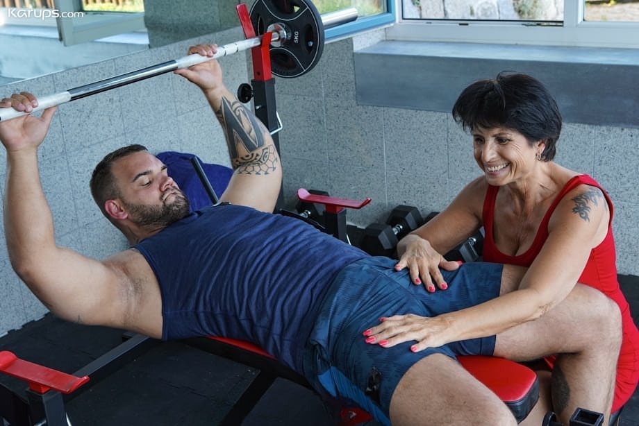 Lusty granny Petra T gets fucked by a muscular tattooed dude at the gym