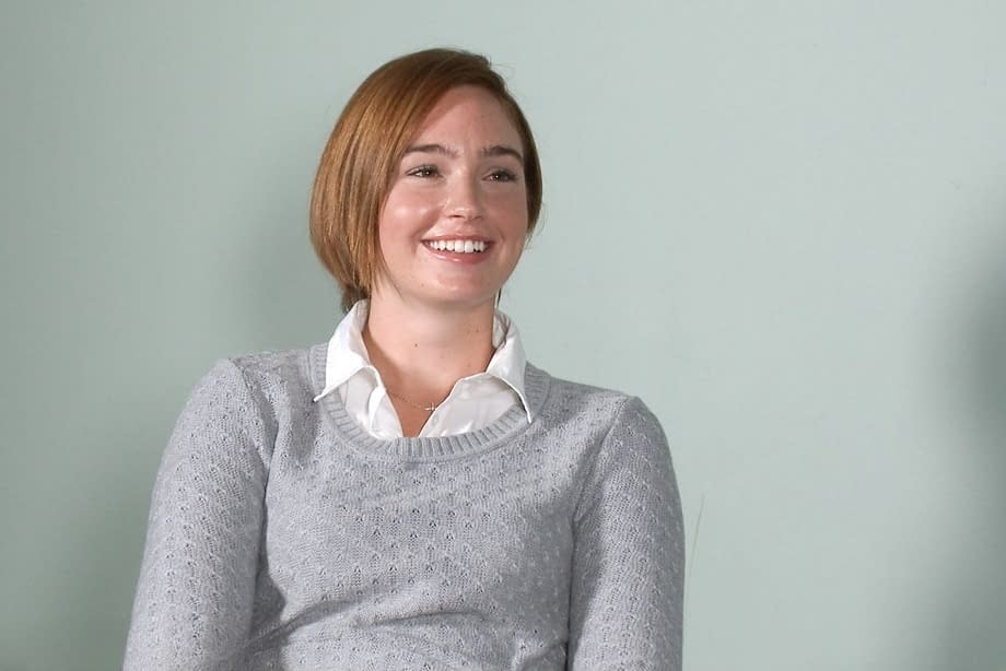 Cute redhead strips stuffy clothing to spread her big ass in porno audition