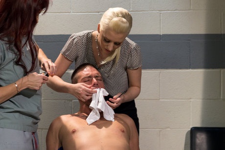 Dental assistant and office manager tie up a man in the back office