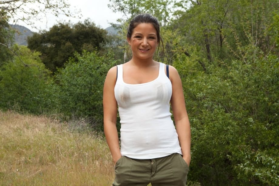 Brunette female Charity Bangs exposes her big boobs and butt while camping