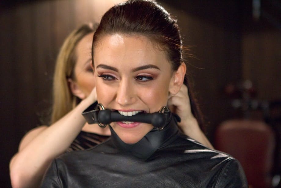 Brunette in a straitjacket gets zapped with electricity before being fisted