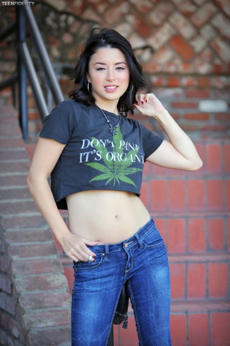 Smoking Asian hottie Daisy Haze licks lollipop while sunning her tiny tits