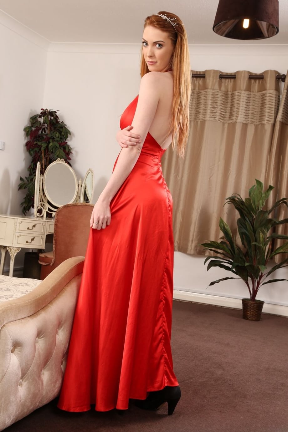 Pale redhead Alice Brookes uncovers her big tits before slipping off her panties