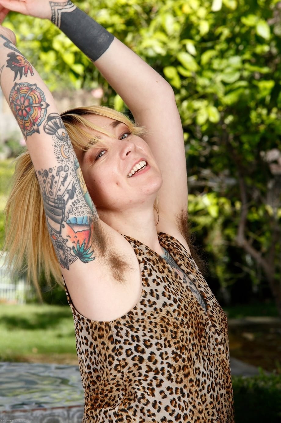 Tattooed minx Felicia Fisher is always ready to show hairy armpits and vagina