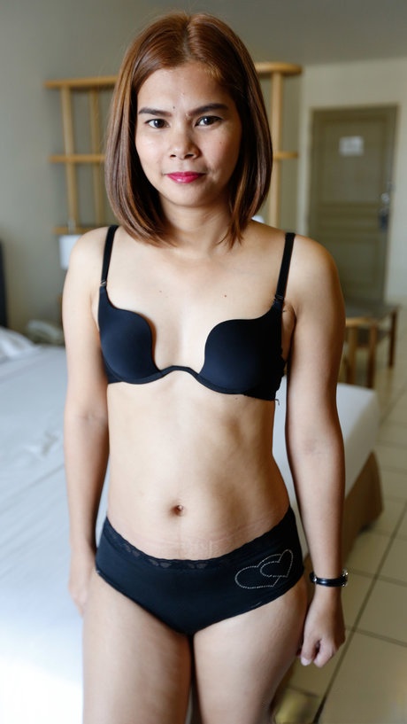 Pretty Thai babe with tiny tits Tam enjoys a strong penis in her trimmed pussy