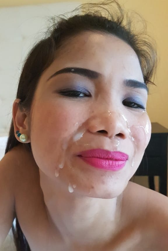 Guy jerks off looking at skinny Filipina in stockings and cums on her face