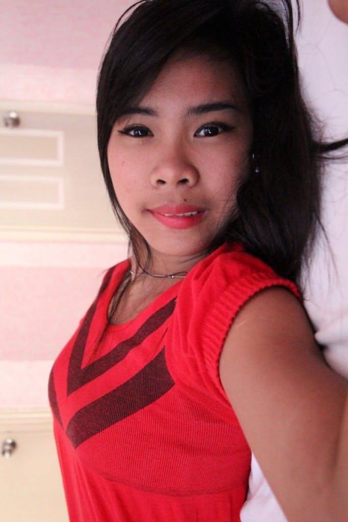 Lovely Filipina Akira strips & shows her fuzzy pussy and small tits