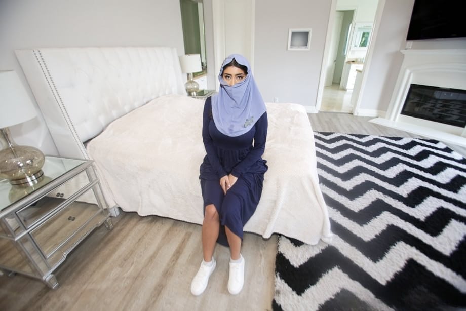 Charming Arab spreading legs to show pussy while wearing a hijab