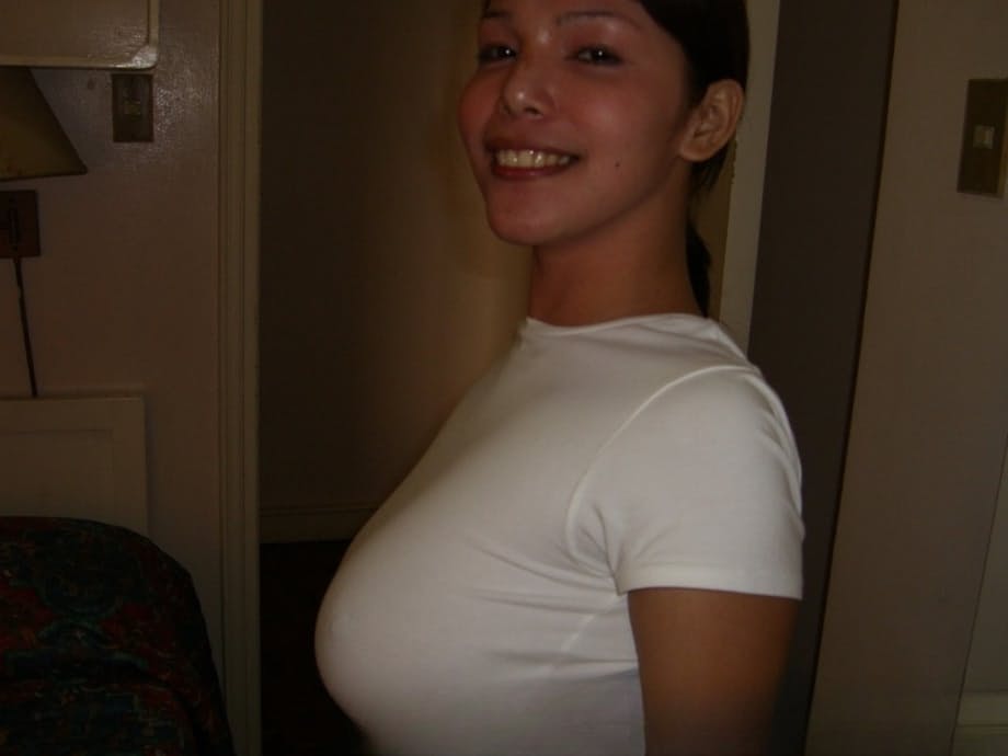 Filipina first timer cups her big naturals after undressing on a bed