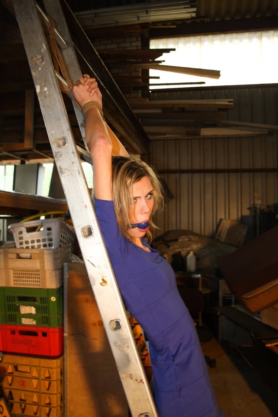 Amateur blonde Irena gagged & tied fully clothed to a ladder for garage grope