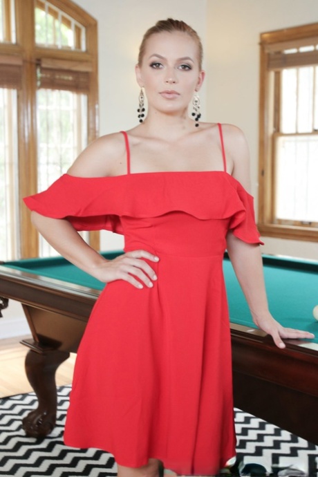 Long haired blonde in ponytail Sloan Harper shows her hot stuff on pool table