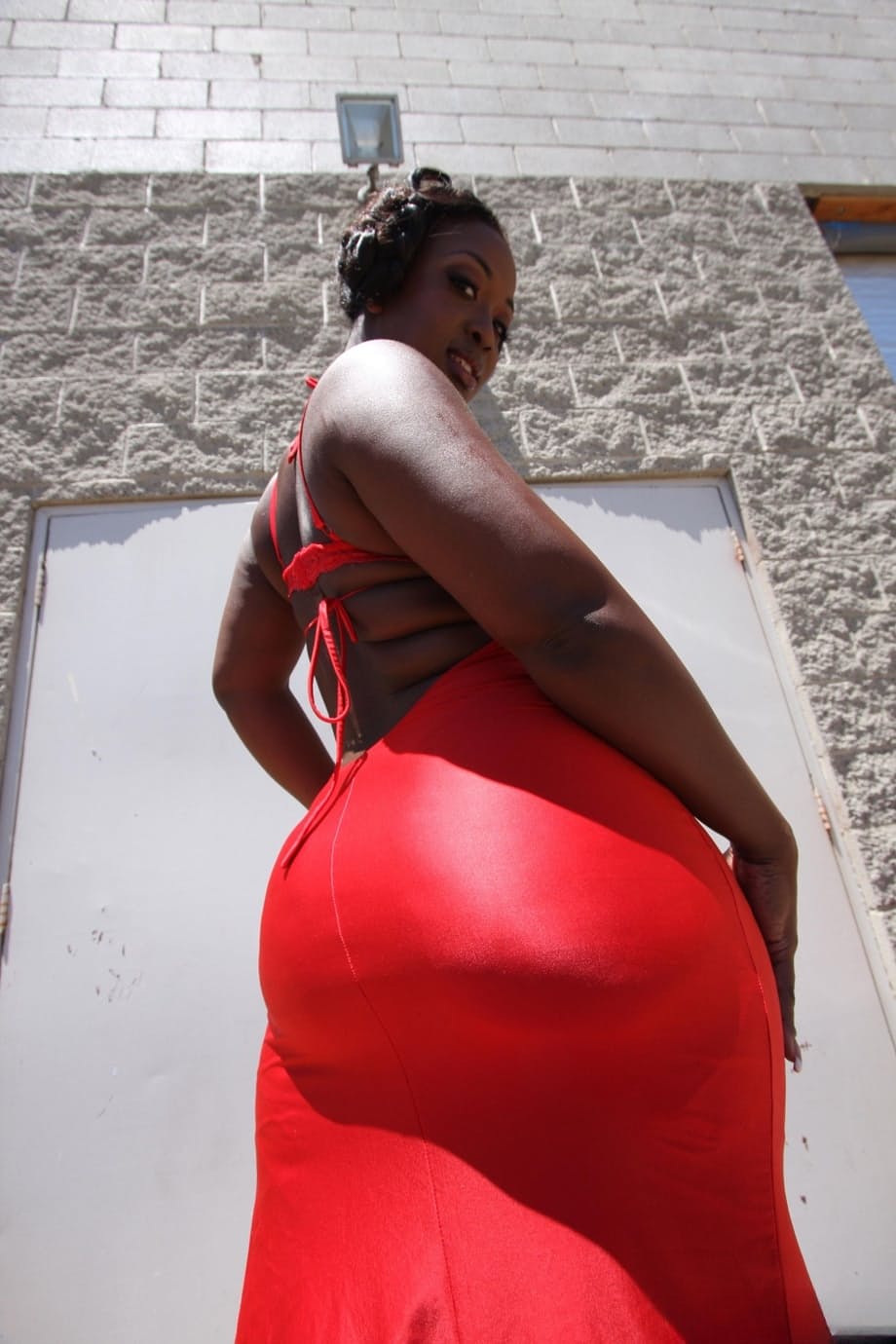 Tremendously busty Jamaican Aryana Starr reveals a huge oiled big ass outside